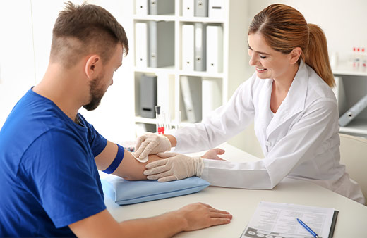 Nurse collecting a phlebotomy blood sample